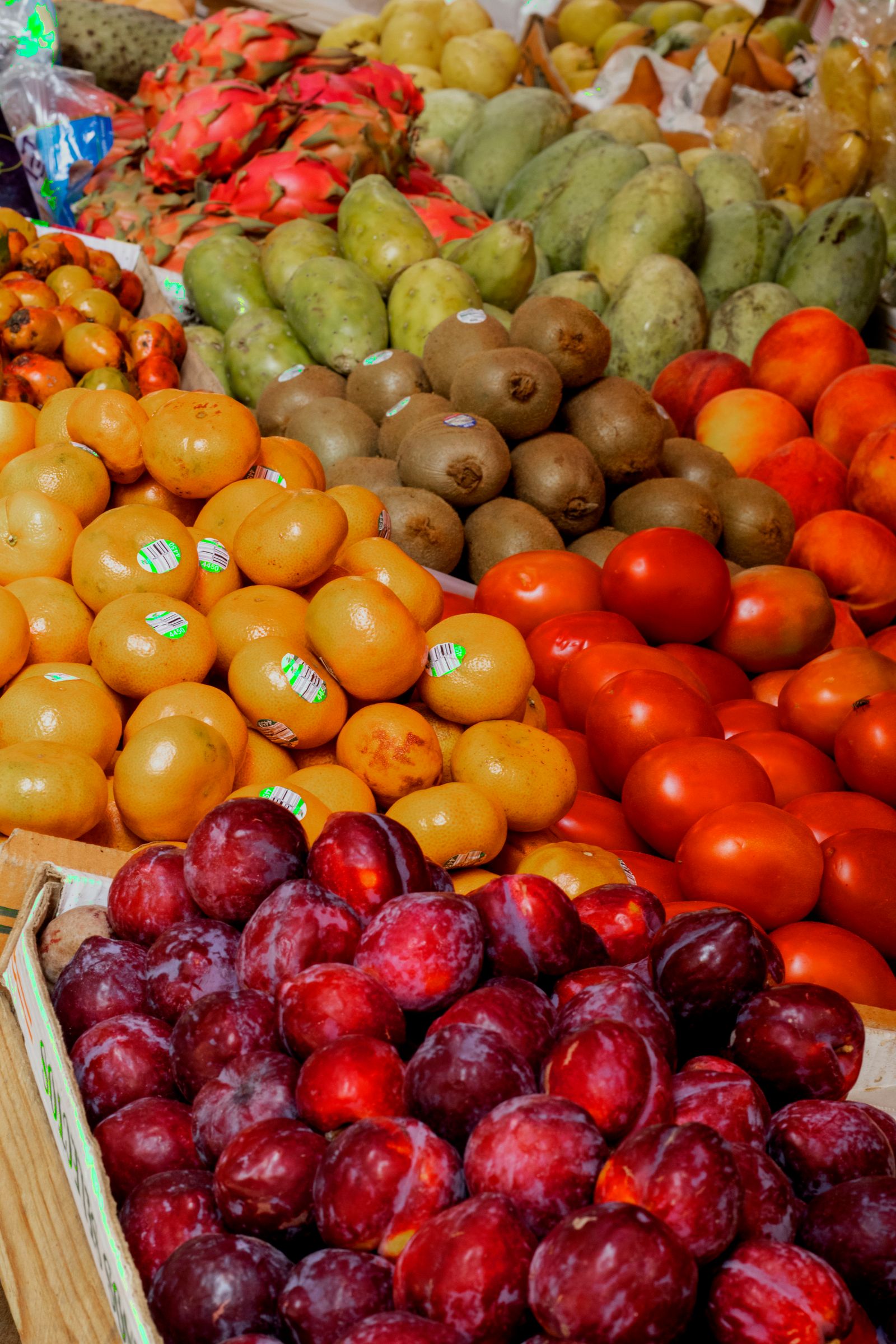 Plums, oranges and peaches at a market